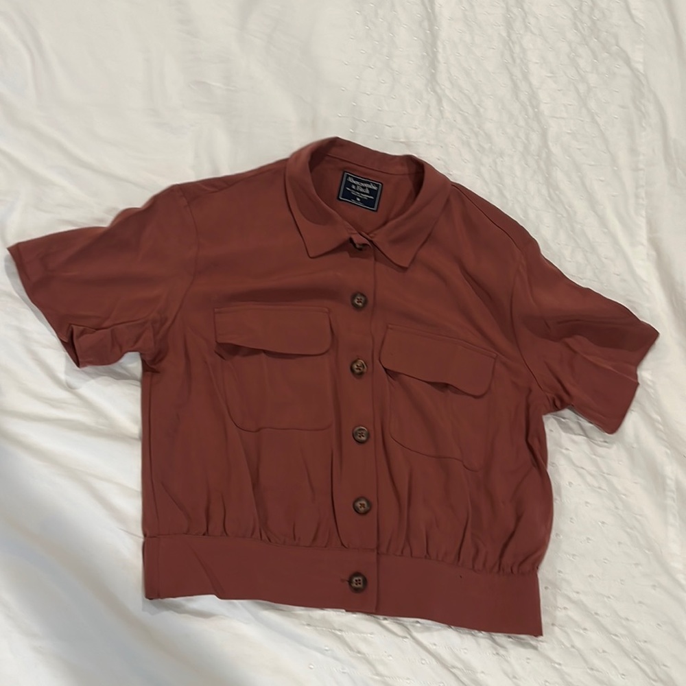 Rust color button up cop shirt